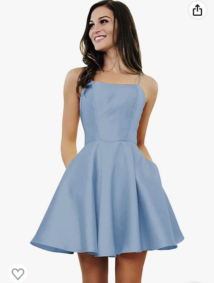 a woman in a short blue dress smiling