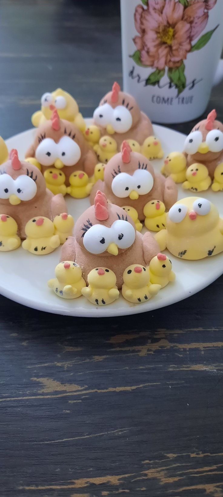 there are many little yellow chickens on the plate