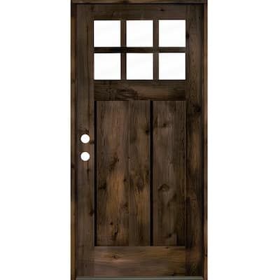 the front door is made out of wood and has two glass panels on each side