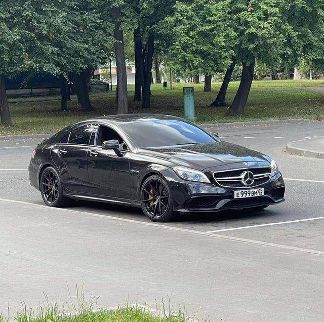 a black car parked in a parking lot