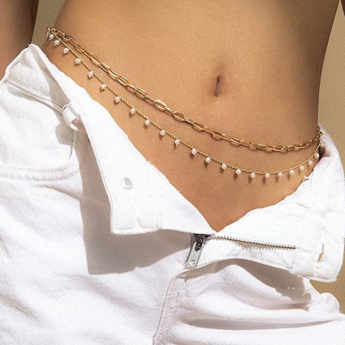 Make a statement with Reetan's Boho Waist Chain featuring high-quality alloy and pearls that won't fade. The adjustable extended chain ensures a perfect fit for women and girls, while the layered design accentuates your body proportions for a feminine and charming look. Perfect for summer beach parties, festivals, and gift-giving, this pearl belly body chain is sure to make you the center of attention. This is an affiliate link & I may earn a commission on qualifying purchases. #Jewelry #Jewels Pearl Waist Chain, Gold Body Chain, Waist Jewelry, Chain Accessories, Body Chains, Gold Bodies, Belly Jewelry, Cross Chain, Gold Collar