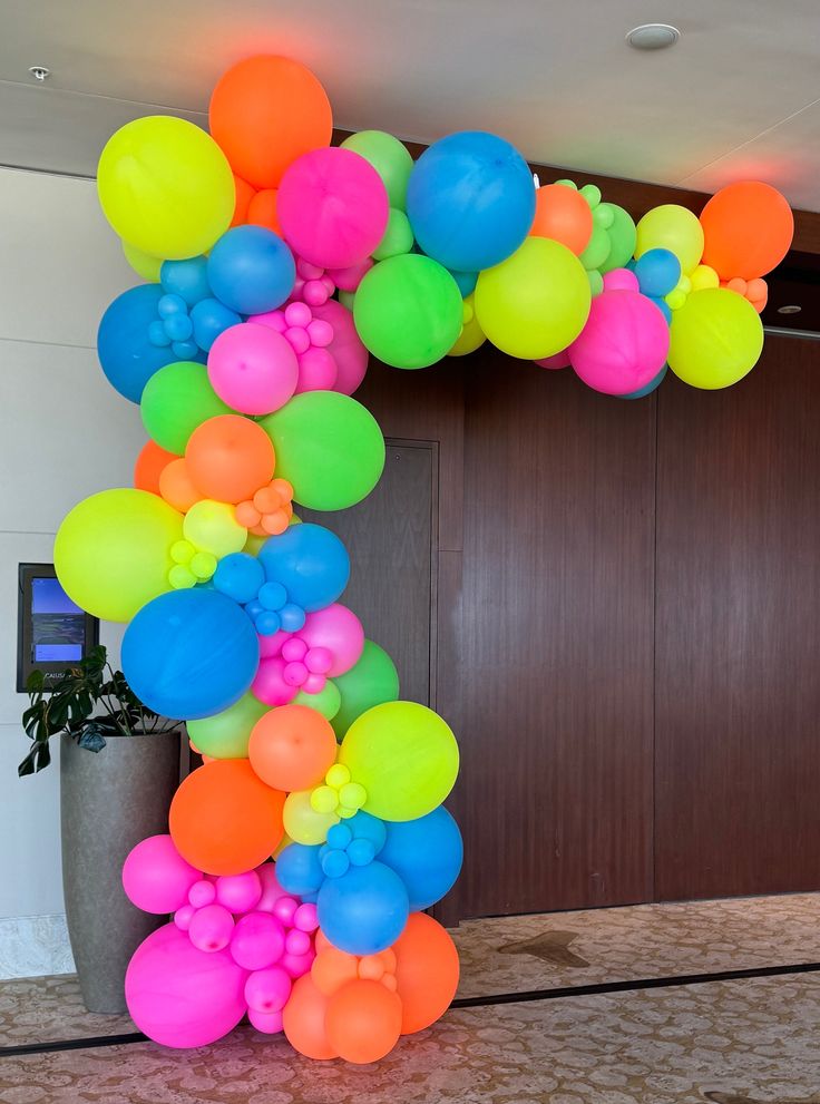 an arch made out of balloons on the floor