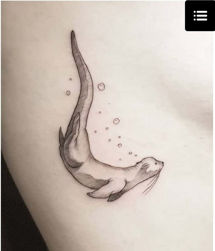 an animal that is on the side of a woman's stomach, with bubbles coming out of it