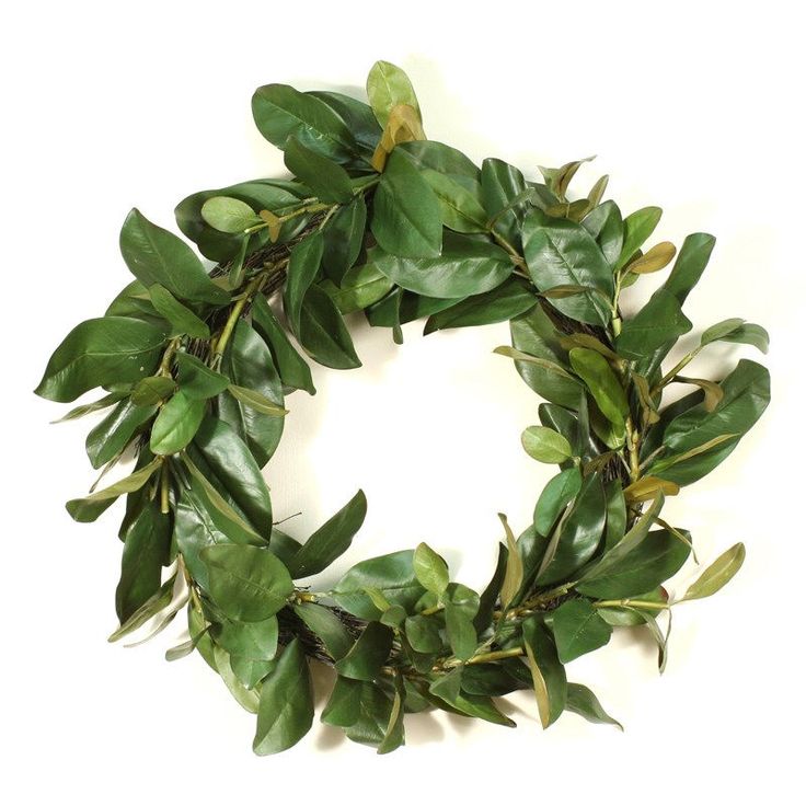 a green wreath with leaves on it