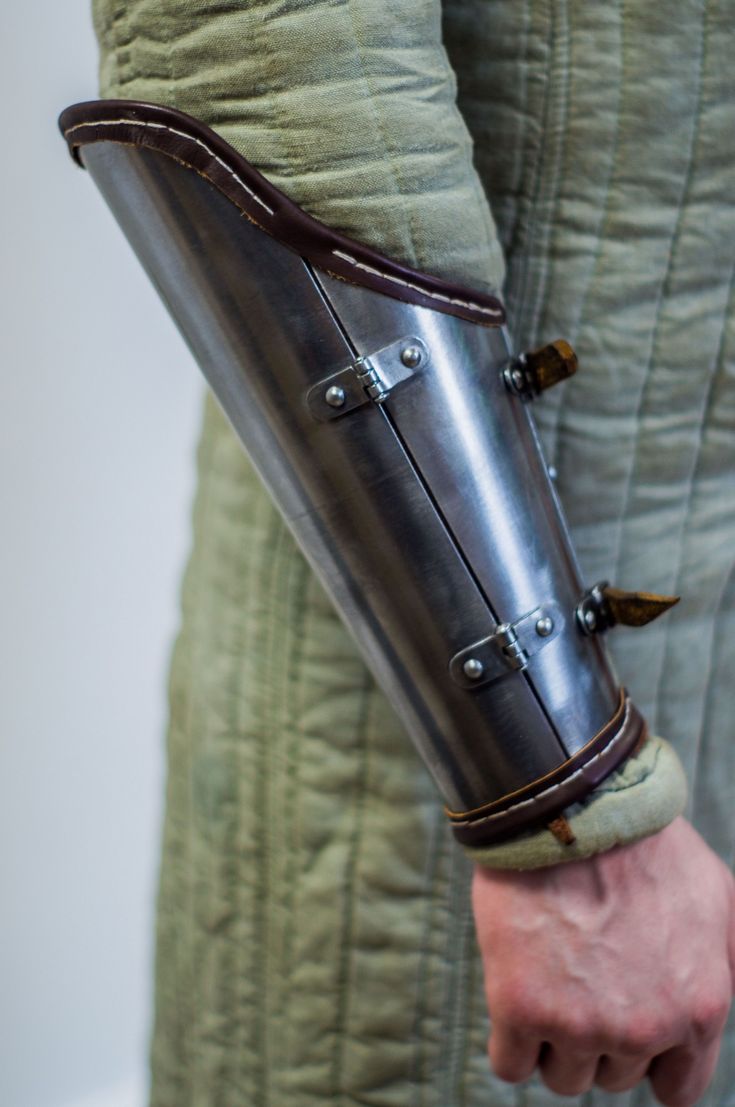 a close up of a person holding a metal object