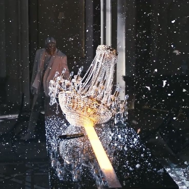 a large crystal sculpture sitting on top of a black table