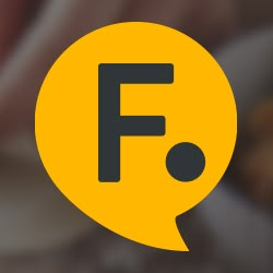 a yellow speech bubble with the letter f in it's center and an image of a hand holding a cell phone