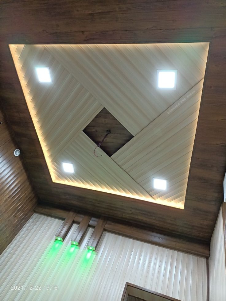 an overhead view of a room with wooden walls and ceiling lights on the ceiling is lit by recessed lighting