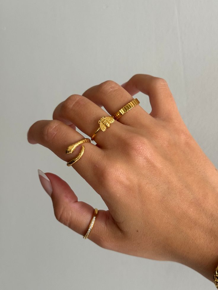 Gold coiled snake ring is adorable and edgy, and a very trendy look for jewelry. Cute serpent snake ring that non-tarnishing - stainless steel and gold - non-tarnishing Socials: Insta: @vasi.jewelry  Site: http://vasijewelry.com Tik Tok: vasi.jewelry Care - protect your jewelry from things that could scratch the surface - keep away from harsh chemicals - store jewelry away from the sun and in a microfiber pouch - clean your pieces with warm water and detergent-free soap and thoroughly dry - poli Gold Minimalist Snake Ring For Promise, Gold Minimalist Snake Ring As Promise Ring, Handmade Gold Snake Ring, Gold Minimalist Snake Ring For Gift, Gold Minimalist Snake Ring, Minimalist Snake Ring As A Gift, Chicago Beats, Dainty Ring Stack, Rings Simple Everyday