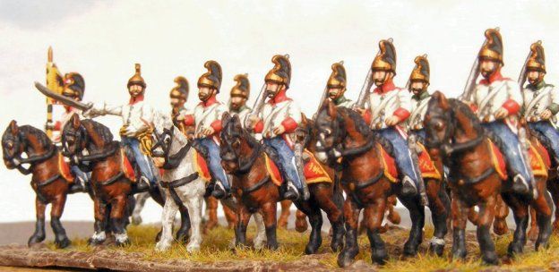 a group of men riding on the backs of horses next to each other in uniforms