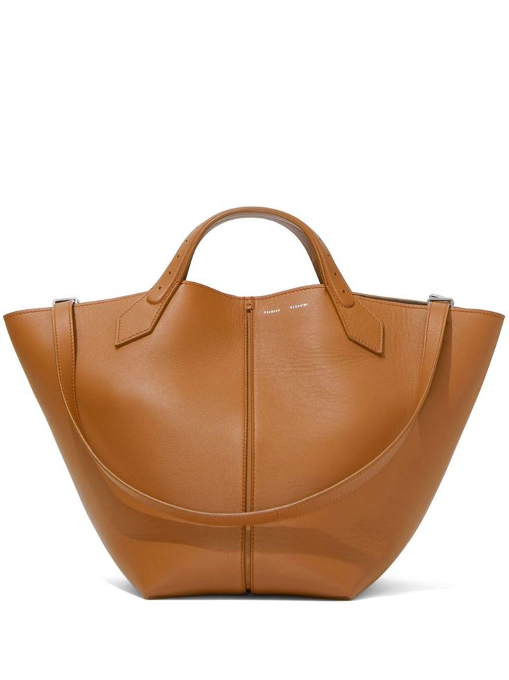 cognac brown leather logo stamp to the front silver-tone hardware two top handles adjustable detachable shoulder strap magnetic fastening internal zip-fastening pocket main compartment Armani 2024, Genuine Leather Handbags Totes, Ps1 Bag, Proenza Schouler Bag, Brown Leather Tote Bag, Large Leather Tote Bag, Nylon Tote Bags, Large Leather Tote, Leather Handbags Tote