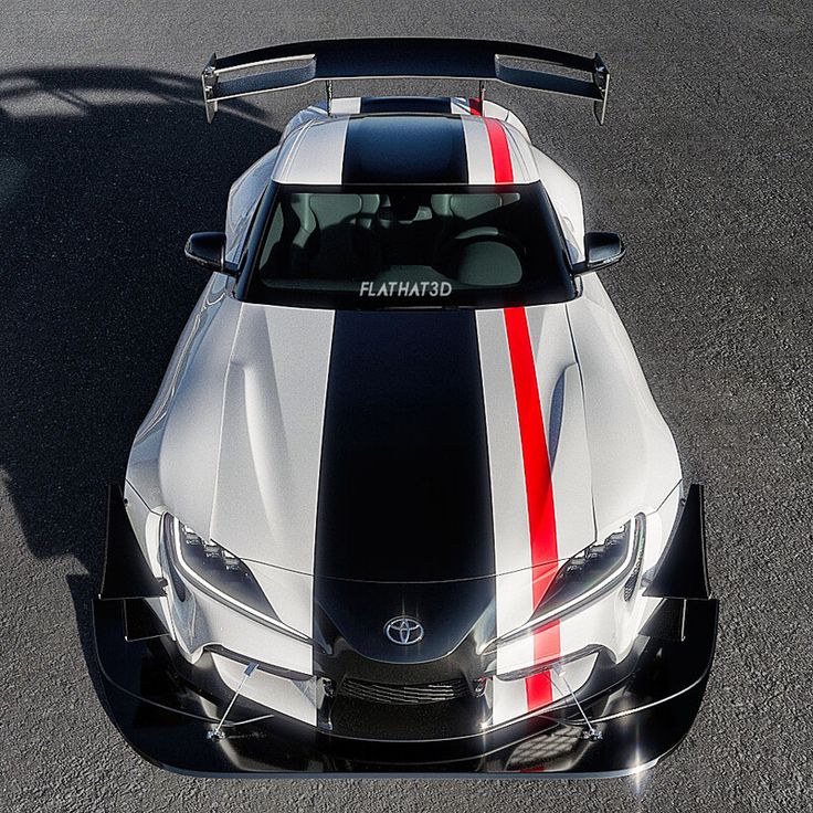 a white and black sports car with red stripes