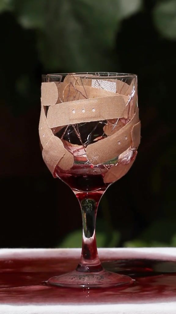 a wine glass with some brown paper wrapped around it