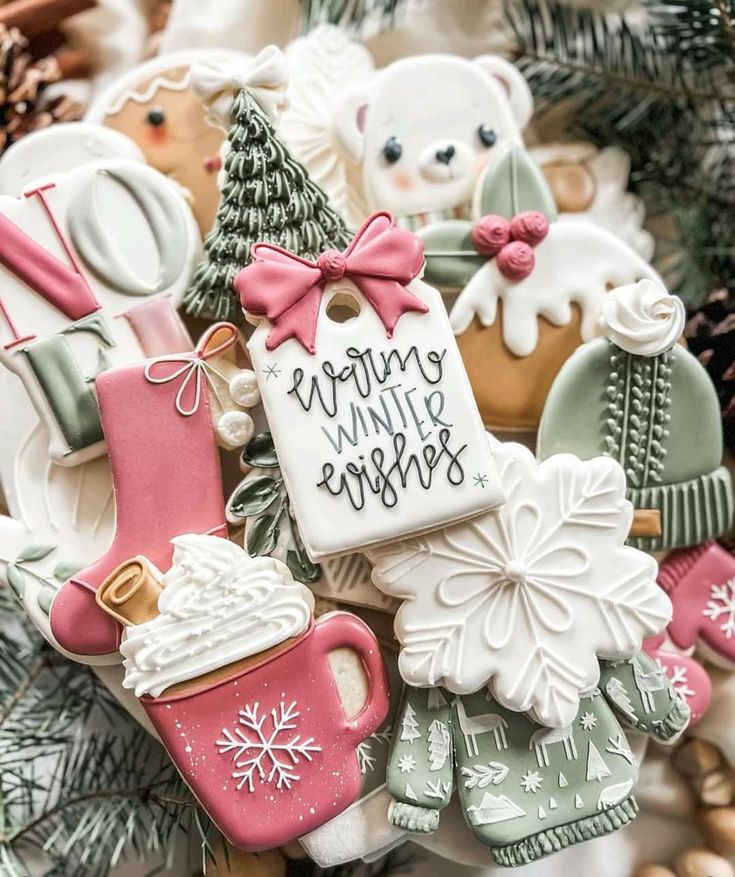 decorated cookies are arranged in the shape of christmas stockings, mittens and coffee mugs