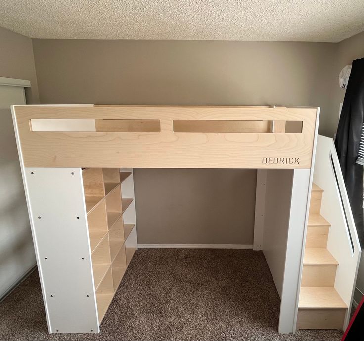 a loft bed with built in shelves underneath it