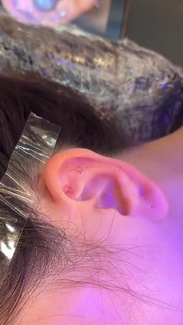 a person with ear piercings on their ears