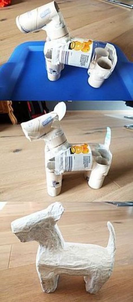 the paper dog is made out of toilet paper and rolled up with glue on it