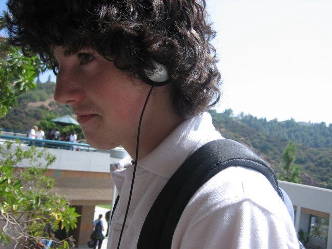 a young man with headphones on his ears