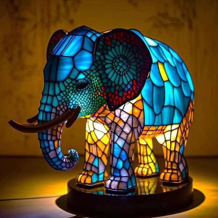 an elephant lamp sitting on top of a table