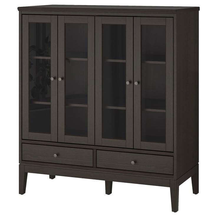 a dark brown cabinet with glass doors and two drawers on the bottom, one door open