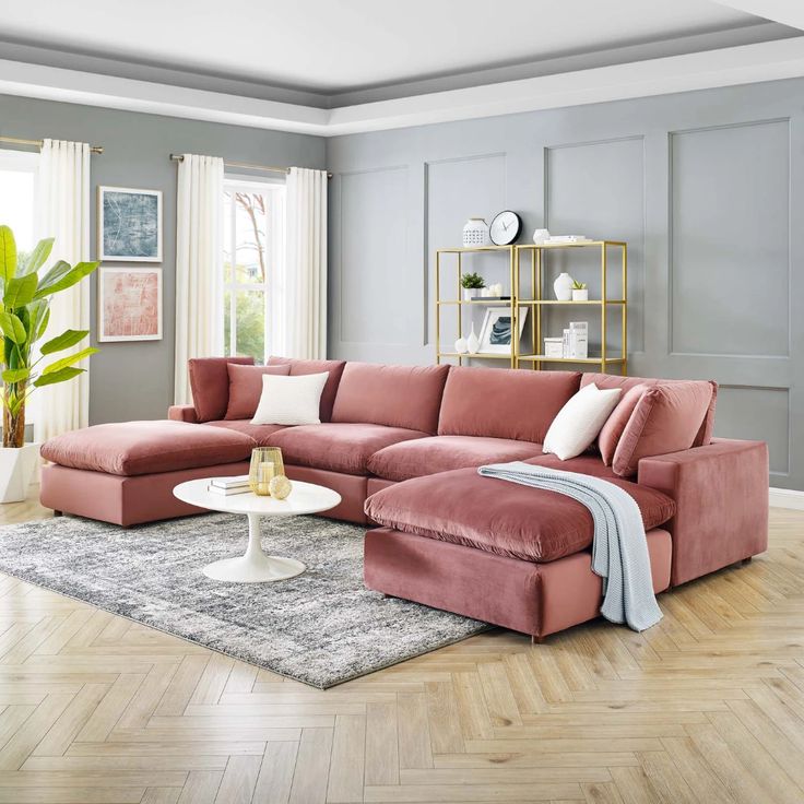 a living room filled with furniture and a rug