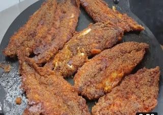 fried food being cooked in a frying pan