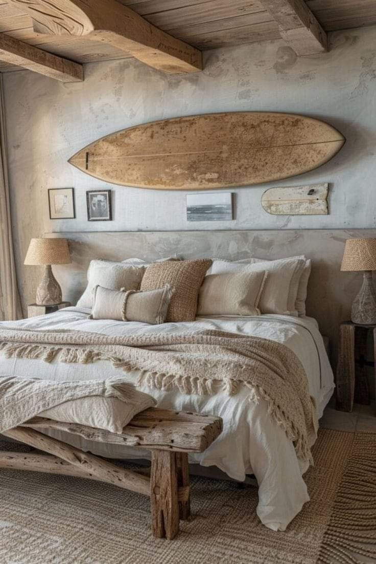 a bedroom with a surfboard mounted to the wall above it's headboard