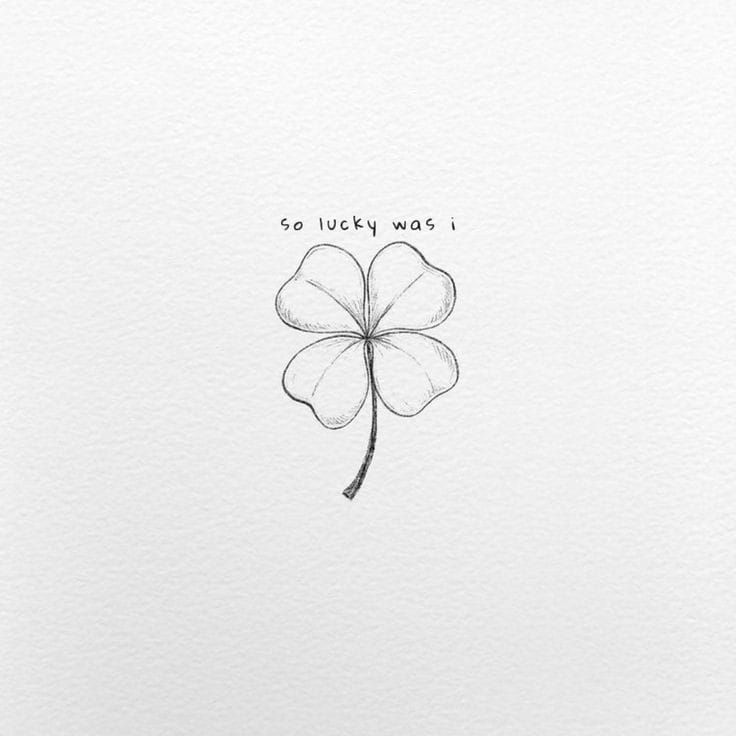 a drawing of a four leaf clover with the words so lucky was i written on it