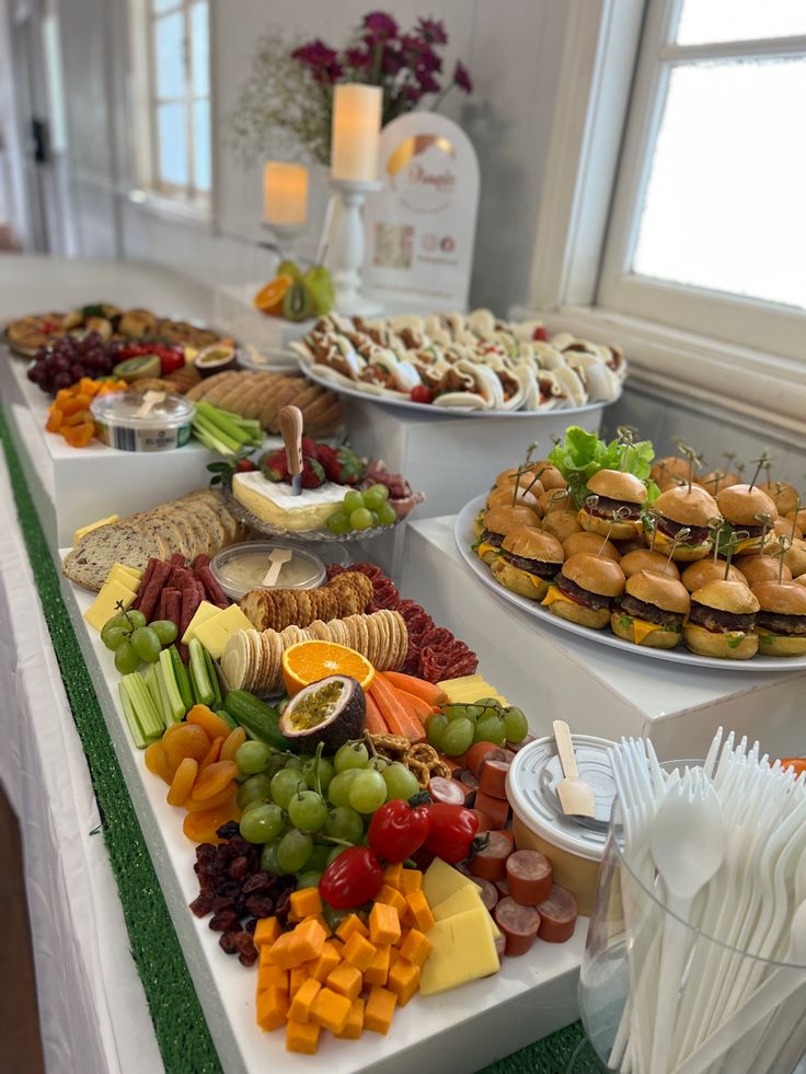 a buffet table filled with lots of different types of food