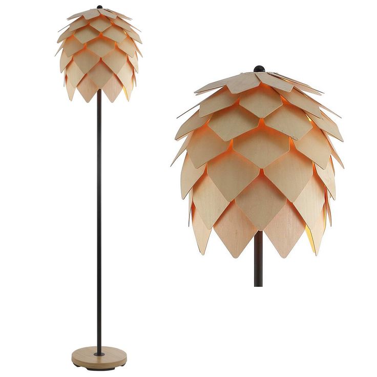 two lamps made out of wood and one is shaped like a pine cone with an orange light on top