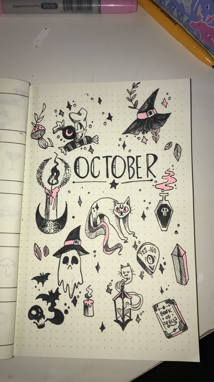 an open notebook with halloween stickers on it and the words october written in black ink