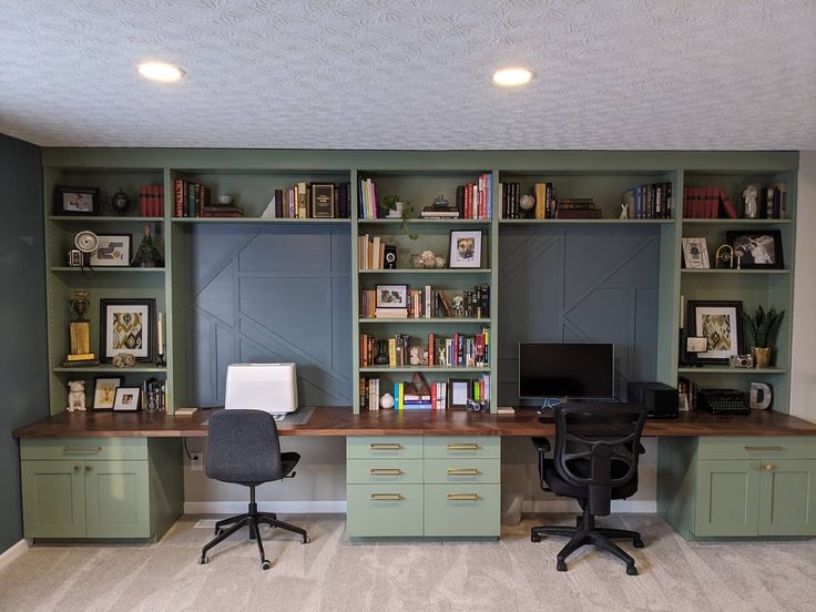 an office with two desks and several bookshelves