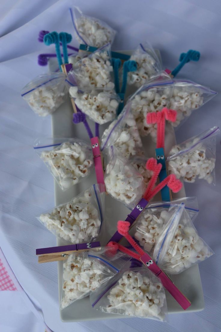 several toothbrushes are wrapped in plastic bags and placed on top of rice krispy treats