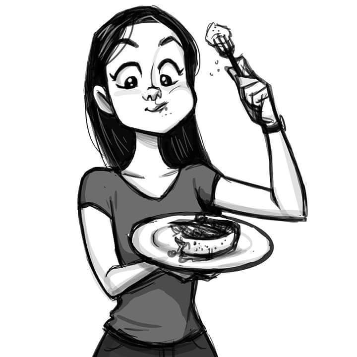 a woman holding a plate with food on it