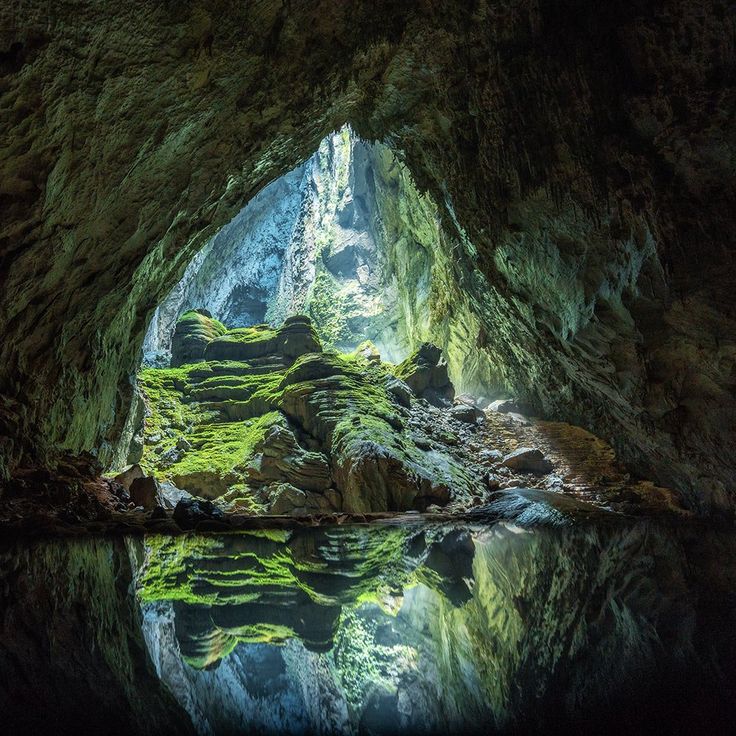 a cave filled with lots of water and rocks