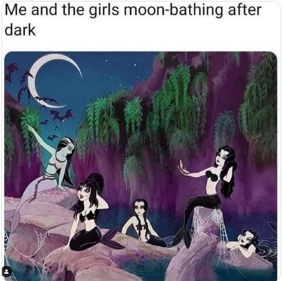 three mermaids sitting on rocks in the water and one is holding a crescent moon