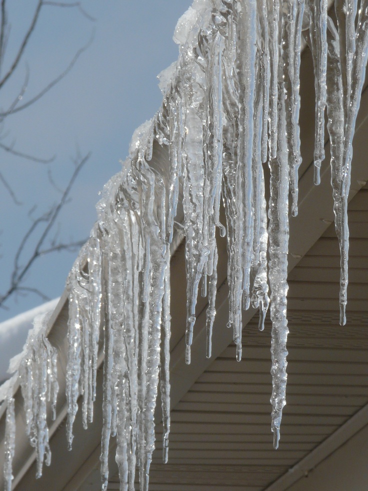 icicles hanging from the roof of a house