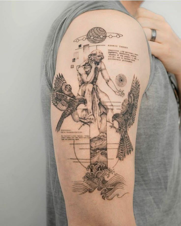 a man with a tattoo on his arm and shoulder that has an image of a woman holding