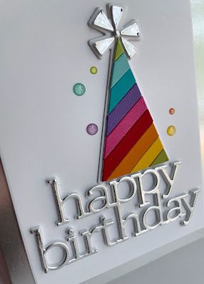 a birthday card with a rainbow colored tree on it