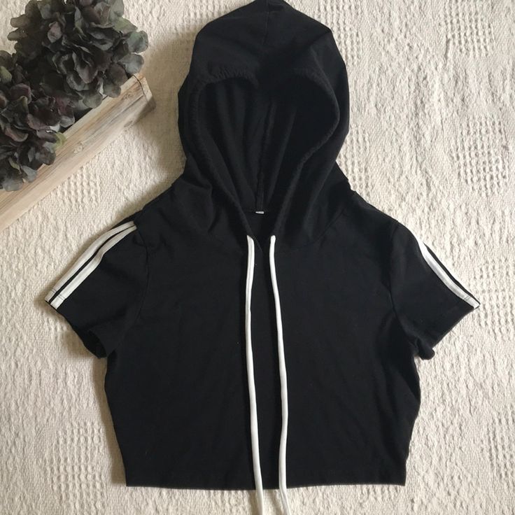 Nwot Black Cropped Pullover Hoodie Size M Short Sleeve With White Stripes On Sleeve Stretchy Material Smoke Free Home Will Ship Priority Mail Within 24 Hours Of Purchase! Hooded Tops With Double-lined Hood For Streetwear, Hooded Top With Double-lined Hood For Streetwear, Black Stretch Hoodie Top, Black Sportswear Top With Drawstring Hood, Black Hoodie Tops In Athleisure Style, Black Stretch Hooded Top, Trendy Hooded Top With Ribbed Cuffs, Trendy Hooded Tops With Ribbed Cuffs, Black Drawstring Hood Top For Streetwear