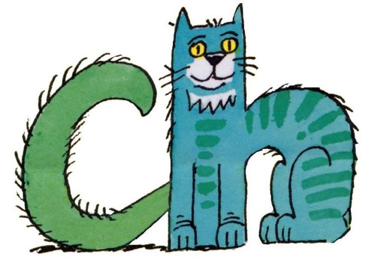 a blue cat sitting next to the letter c