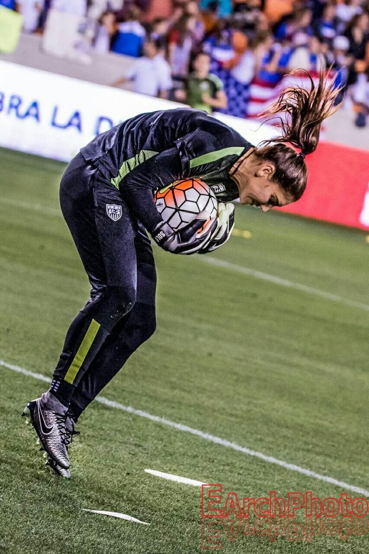 a female soccer player in action on the field