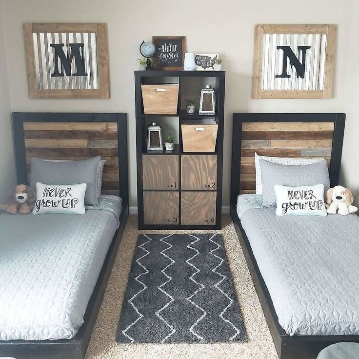 two twin beds in a bedroom with wooden headboards