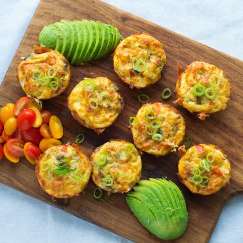 small appetizers are arranged on a cutting board