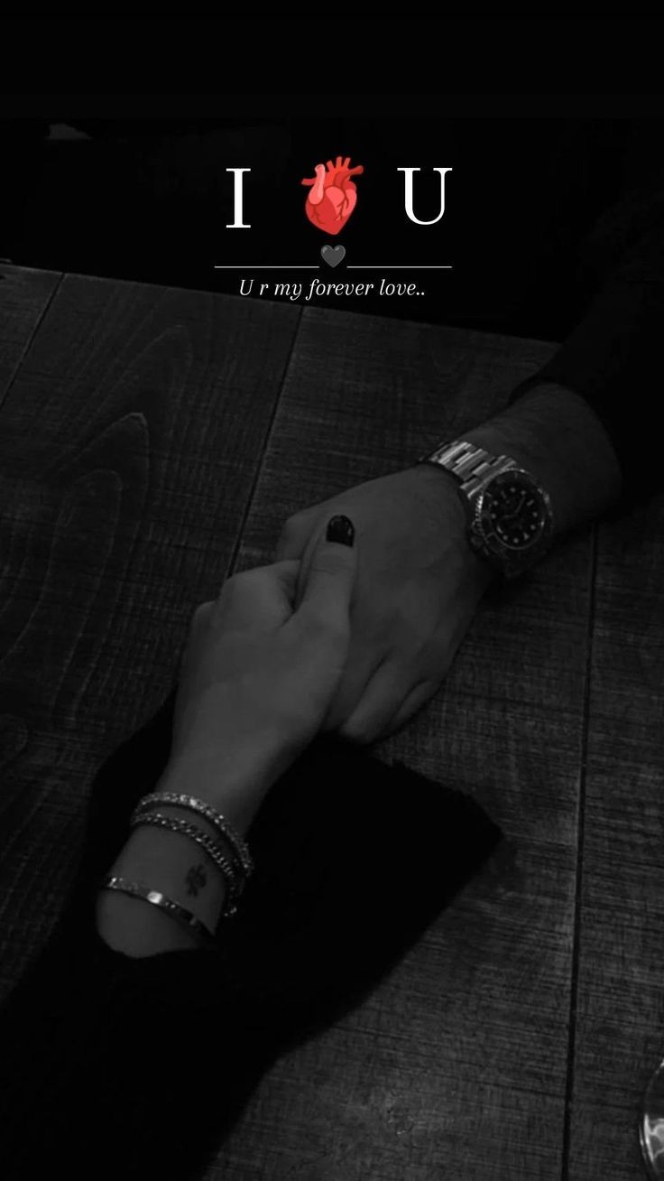 two people holding hands with the words i love you written on them in black and white