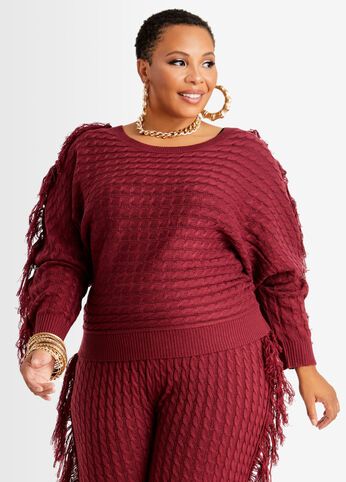 Flaunting flirty fringe trim along its sleeves, this cozy cable knit plus size sweater can be matched with a warm and stylish plus size jogger for a luxurious and unexpected take on a sweater set. Shop both pieces today. Fall Ribbed Cuffs V-neck Sweater For Loungewear, Oversized Fringe Sweater For Winter, Fringe Knit Sweater, Plus Size Ribbed Sweater, Brown Fringe Sweater, Sweater Sets, Plus Size Knitwear, Plus Size Joggers, Plus Size Sweater