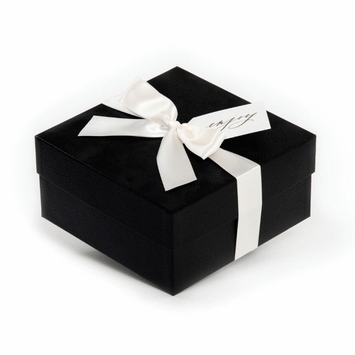 a small black box with a white ribbon