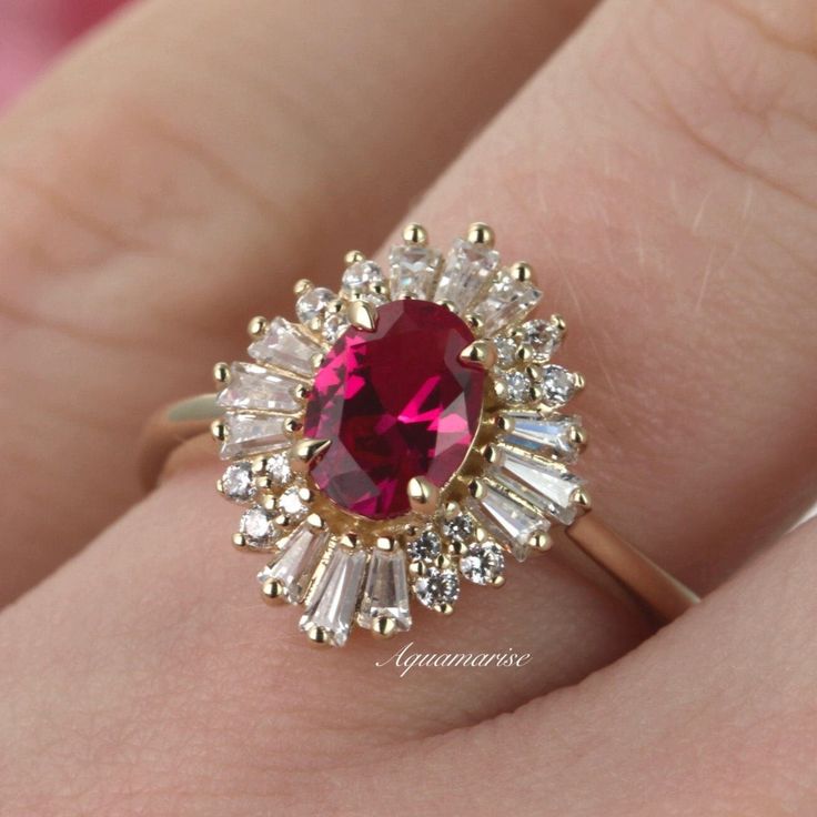 Beautiful Vintage Inspired Ruby Ring ►Base Metal: 925 Sterling Silver ►Plating: 14K Yellow Gold Main Stone: RubyColor: RedGemstone Creation: Lab-Grown Stone Shape: Oval CutGem size: 7.0 x 5.0 mmCarat Weight: 0.76 ct. (Approx.) Accented With Simulated Diamonds ►Please be aware that plated jewelry can wear off over time, if this is a concern we would suggest going with the sterling silver or solid gold jewelry option. ►Style: Art-Deco Stackable Engagement Ring, Ruby Ring Vintage, Silver Engagement Ring, Ruby Engagement Ring, Sterling Silver Engagement Rings, Silver Engagement Rings, Solid Gold Jewelry, Anniversary Gift For Her, Engagement Ring Wedding Band