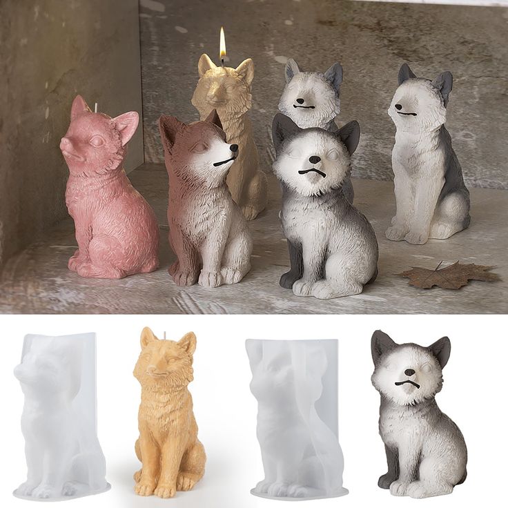 four different colored cat figurines sitting next to each other