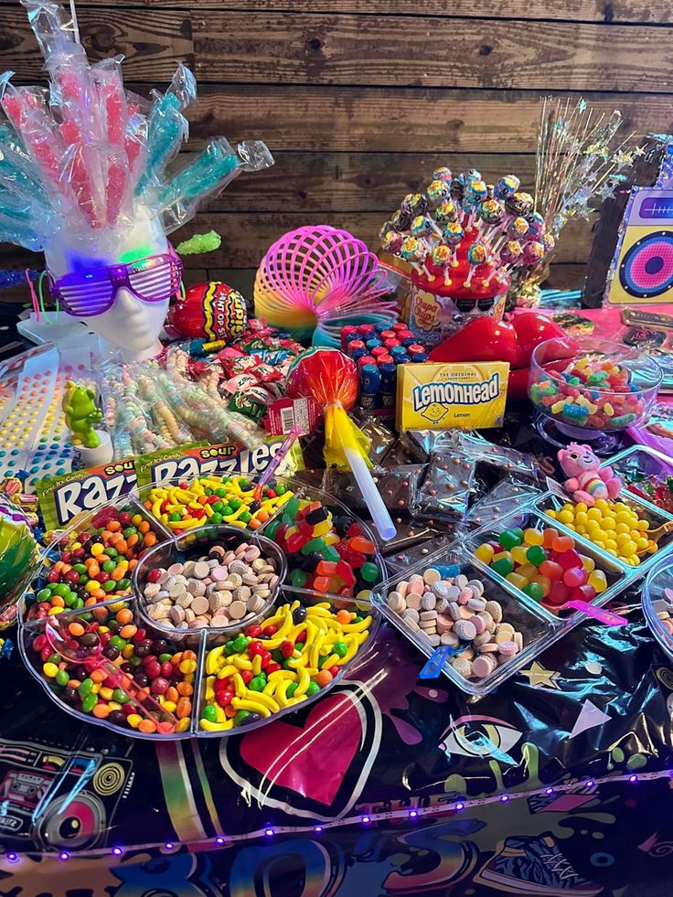 a table topped with lots of candy and candies